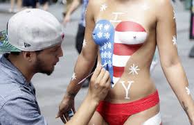 Desnudas topless women in Times Square involved in two 