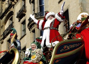 Santa Claus waves as he rides on his float down Central Park West during the 87th Macy's Thanksgiving Day Parade in New York