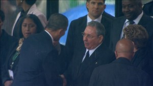 U.S. President Obama shakes hands with Cuban President Castro during Nelson Mandela's national memorial service in Johannesburg