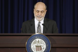 U.S. Federal Reserve Chairman Bernanke pauses during remarks at his final planned news conference before his retirement, at the Federal Reserve Bank headquarters in Washington