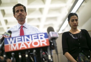 File photo of New York mayoral candidate Anthony Weiner and his wife Huma Abedin attending a news conference in New York