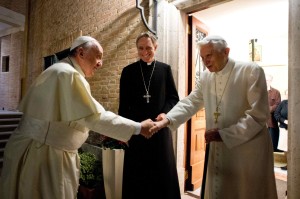 Pope Francis shakes hands with Pope Emeritus Benedict XVI at the Mater Ecclesiae monastery at the Vatican