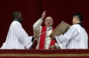 Pope Francis makes a blessing as he delivers his first "Urbi et Orbi" message from the balcony overlooking St. Peter's Square at the Vatican