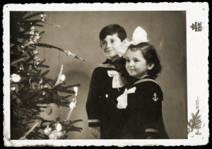 The Mandil family was Jewish, and Moshe took this portrait to promote his photography studio for the Christmas season. When Germany invaded Yugoslavia the following year, the Mandil family tried to flee their hometown of Novi Sad, but they were detained by SS officers. Moshe showed them the photograph of his children by the Christmas tree to prove they couldn’t be Jewish. The Germans let them go, unaware they allowed a Jewish family to proceed to safety.