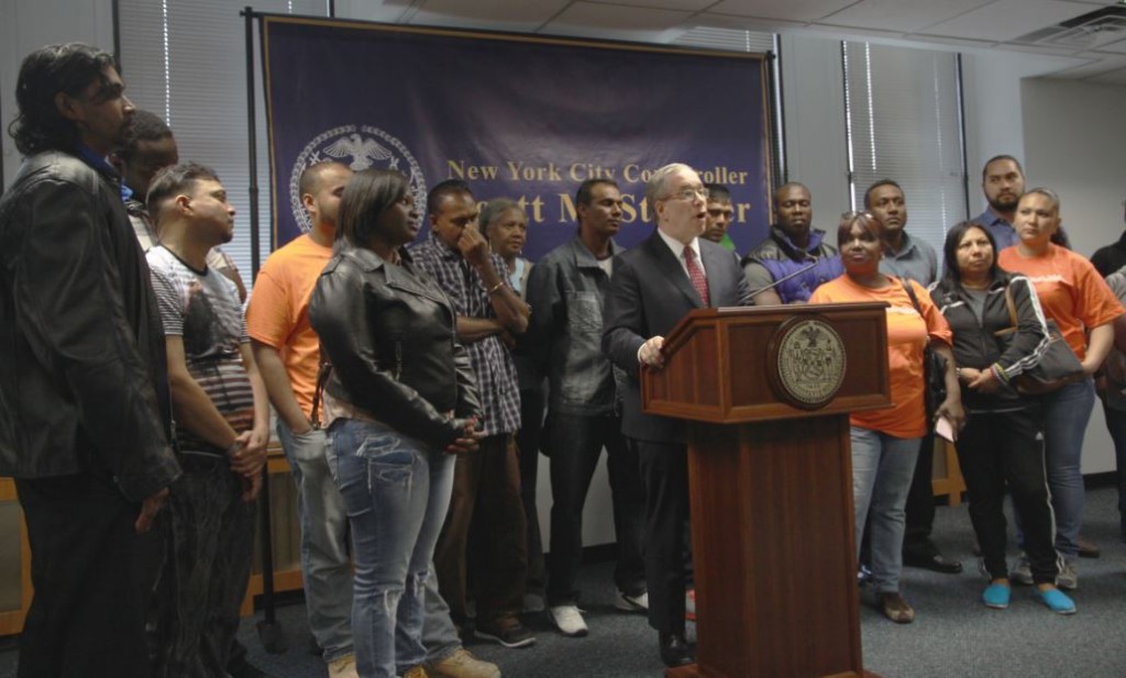  On Monday, New York City Comptroller Scott M. Stringer presented checks to immigrant workers who were cheated out of nearly $1 million in wages. Credit: Office of the NYC Comptroller