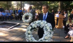 Chris Fugazy, presently Chief Operating officer, North Bronx health Network, laying one of the wreaths in memory of those who dies on 9/11.