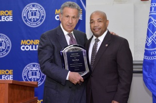Speaker Carl Heastie is pictured with Monroe College President Stephen Jerome, who presented him with an award to honor and recognize his distinguished career in public service.