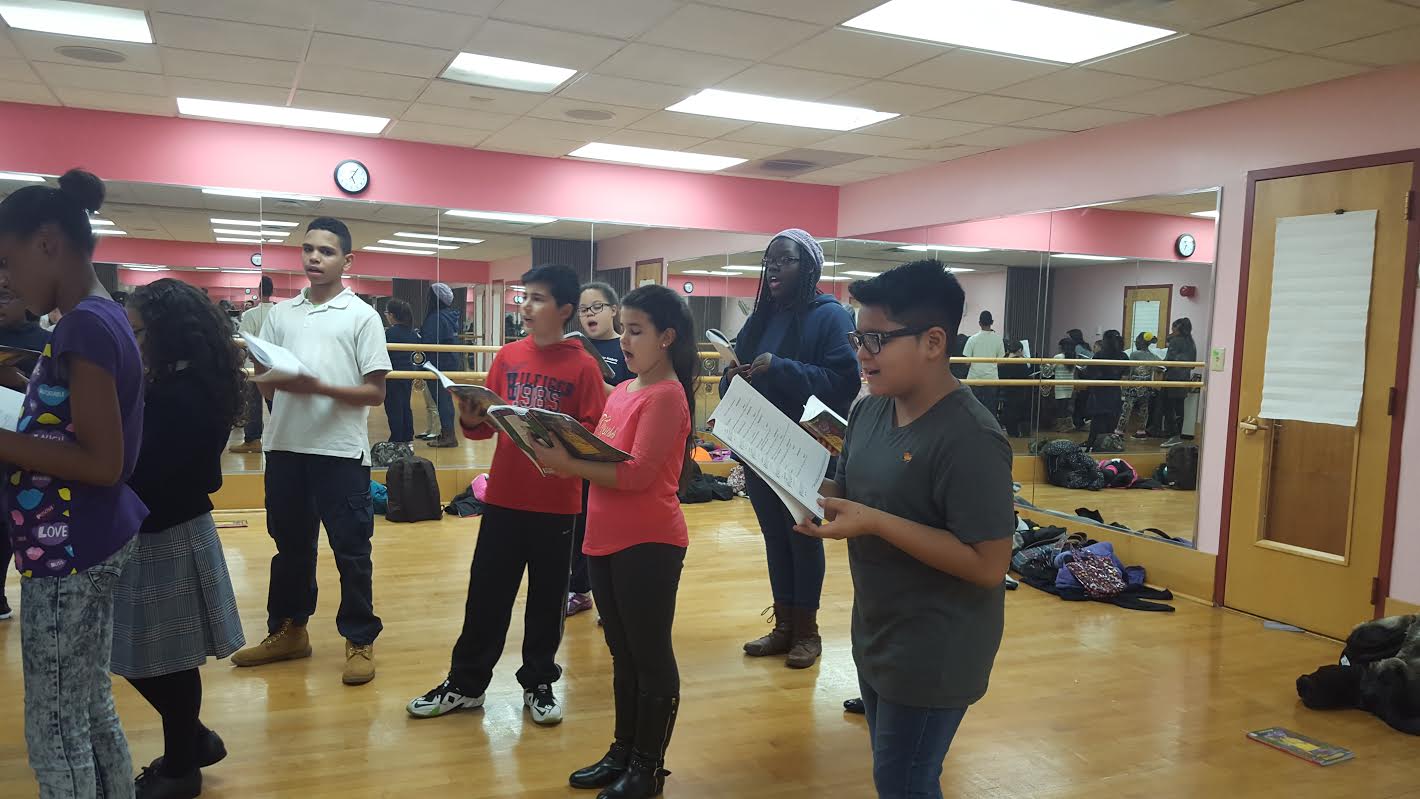 Cast rehearsing a song