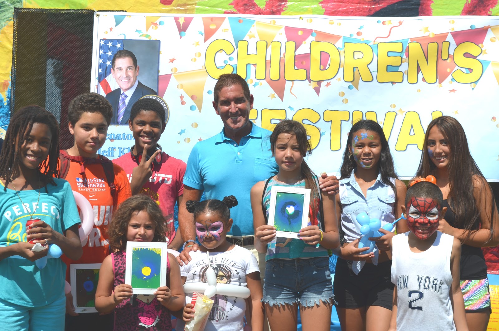 Senator Klein posing with local youth at the Children's Festival. 