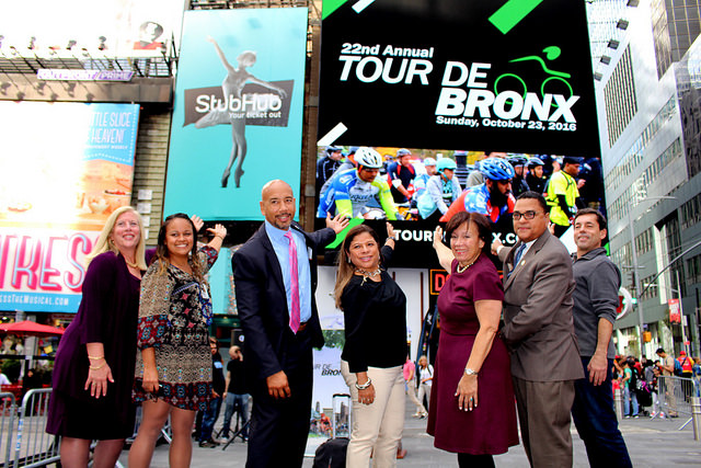Bronx Borough President was joined at Times Square by Bronx officials as well Tour de Bronx sponsors to tout the event’s new billboard that will be on full display at the “The Crossroads of the World.” Pictured: (from left to right): Coca Cola Refreshments Vice President Donna Cirolia, Office of Community Relations & Mosholu Preservation Corporation Senior Director Melissa Cebollero, Bronx Borough President Ruben Diaz Jr., The Bronx Tourism Council Executive Director, President of the Bronx Overall Economic Development Corporation Marlene Cintron, Lehman College Director of Government Relations & Community Development Institutional Advancement Nestor Montilla Sr.; and Bike Rent NYC Executive Manager Mark Derho.