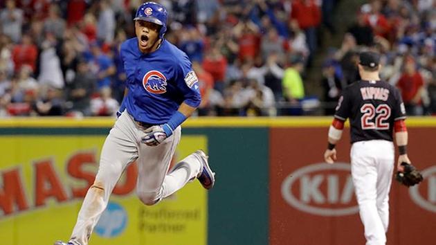Chicago Cubs' Addison Russell celebrates after his grand slam against the Cleveland Indians during the third inning of Game 6 of the Major League Baseball World Series. (AP Photo/Matt Slocum)