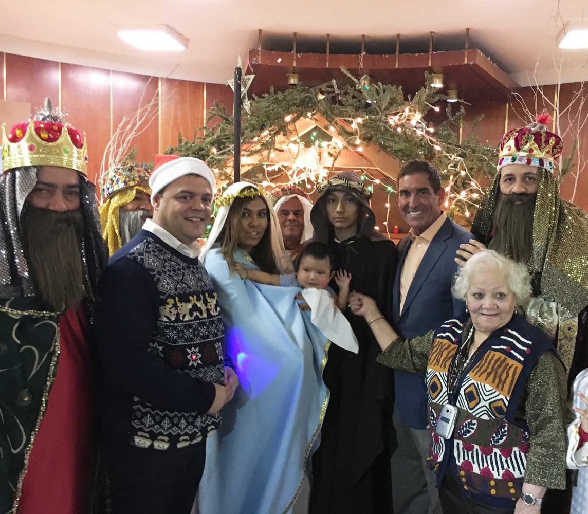 (left to right): Senator Jeff Klein, Assemblyman Luis Sepulveda, and District Leader Julia Rodriguez are joined by the Holy Family Choir and nativity performers as they celebrate Three Kings Day.
