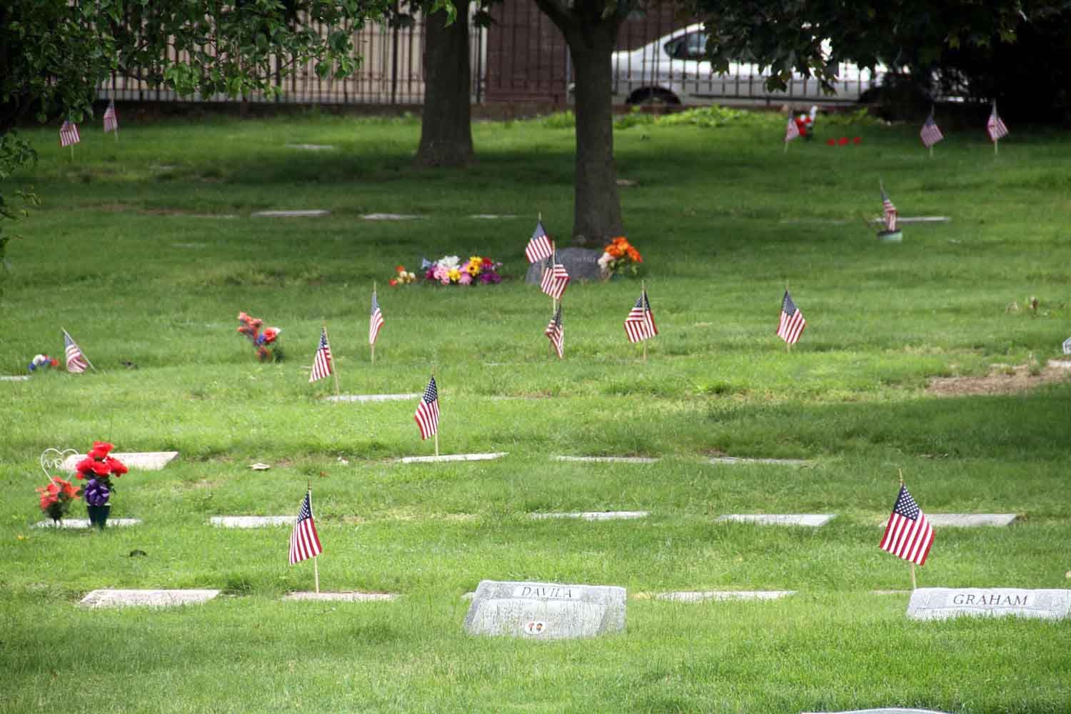 Flags mark the graves of the Zinnia section of Woodlawn Cemetery where many veterans of the Korean War are laid to rest.--Photo by David Greene