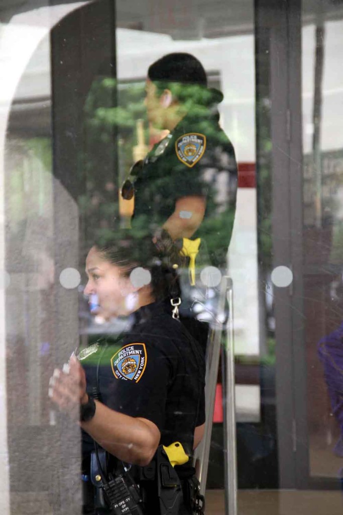 Police interview bank employees after an armed man attempted to rob the bank on May 27.--Photo by David Greene
