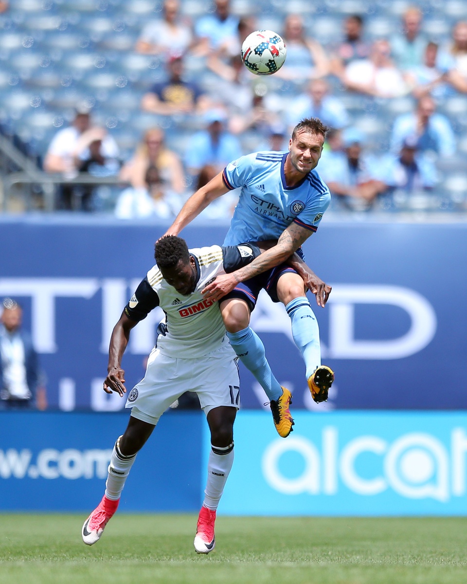 Jun 3, 2017; New York, NY, USA; New York City FC defender Maxine Chanot (4) and Philadelphia Union forward C.J. Sapong (17) fight for a header during the first half at Yankee Stadium. Mandatory Credit: Brad Penner-USA TODAY Sports
