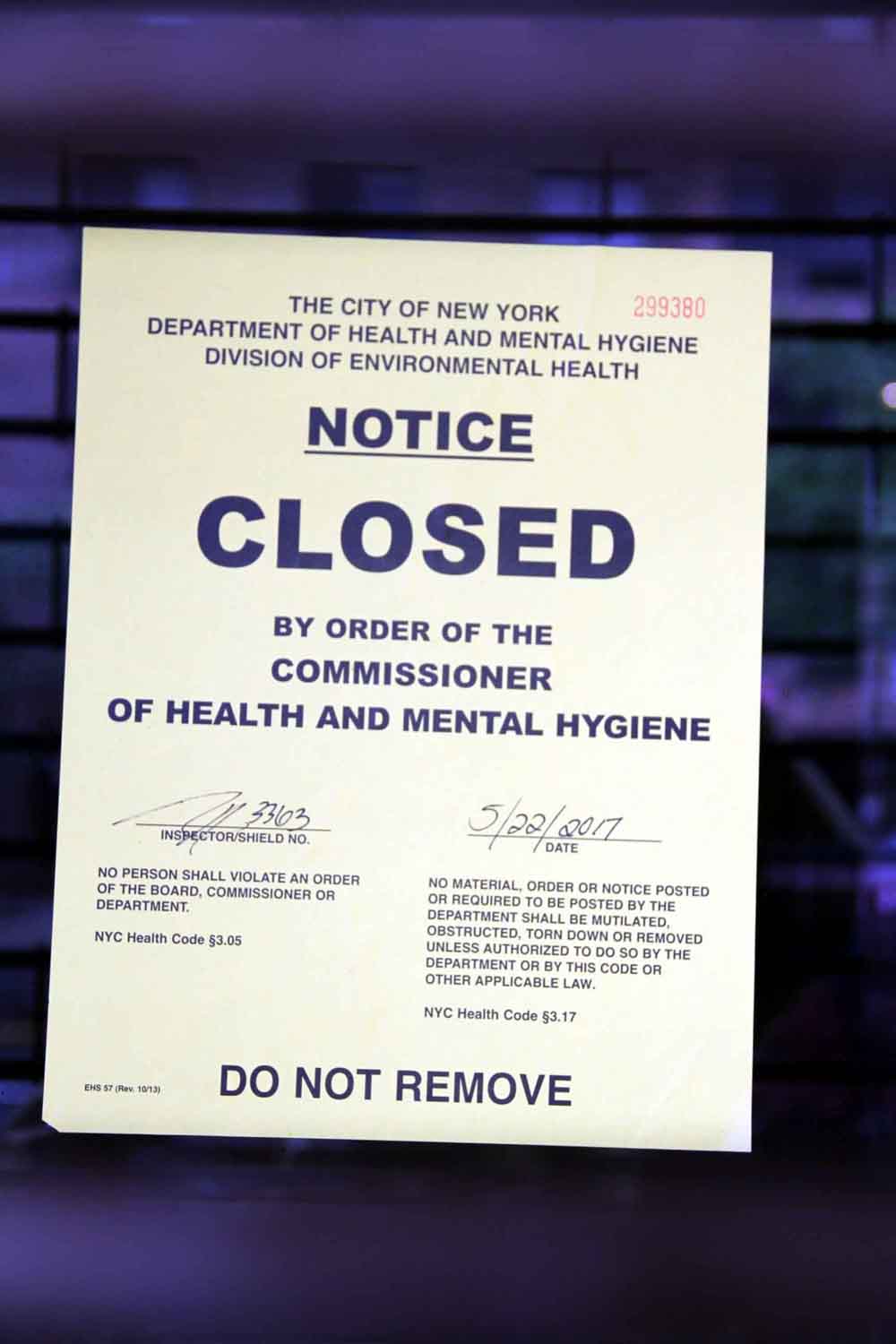 A sticker announces the closure by the Department of Health.--Photo by David Greene