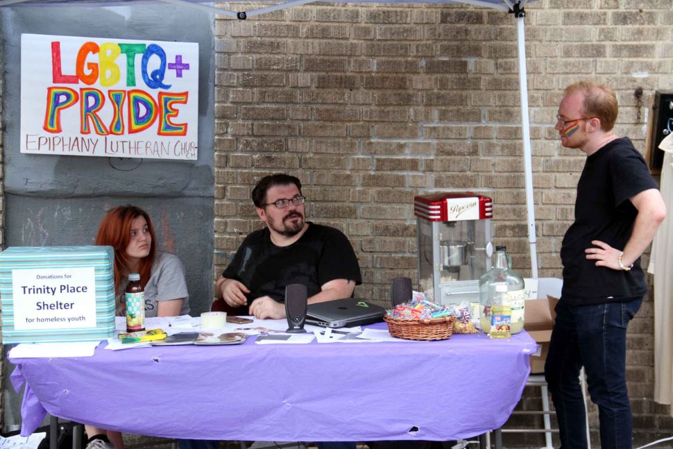 Members of the Epiphany Lutheran Church hold an open house along Decatur Avenue in honor of Gay Pride Week. Photo by David Greene