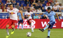 Aug 25, 2017; Harrison, NJ, USA; New York City FC midfielder Maximiliano Moralez (10) scores a goal past New York Red Bulls defender Aaron Long (33) during the second half at Red Bull Arena. Mandatory Credit: Brad Penner-USA TODAY Sports