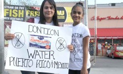 A mother and daughter in Bedford Park seek food and water donations along Webster Avenue for hurricane victims in Puerto Rico and earth quake victims in Mexico.--Photo by David Greene