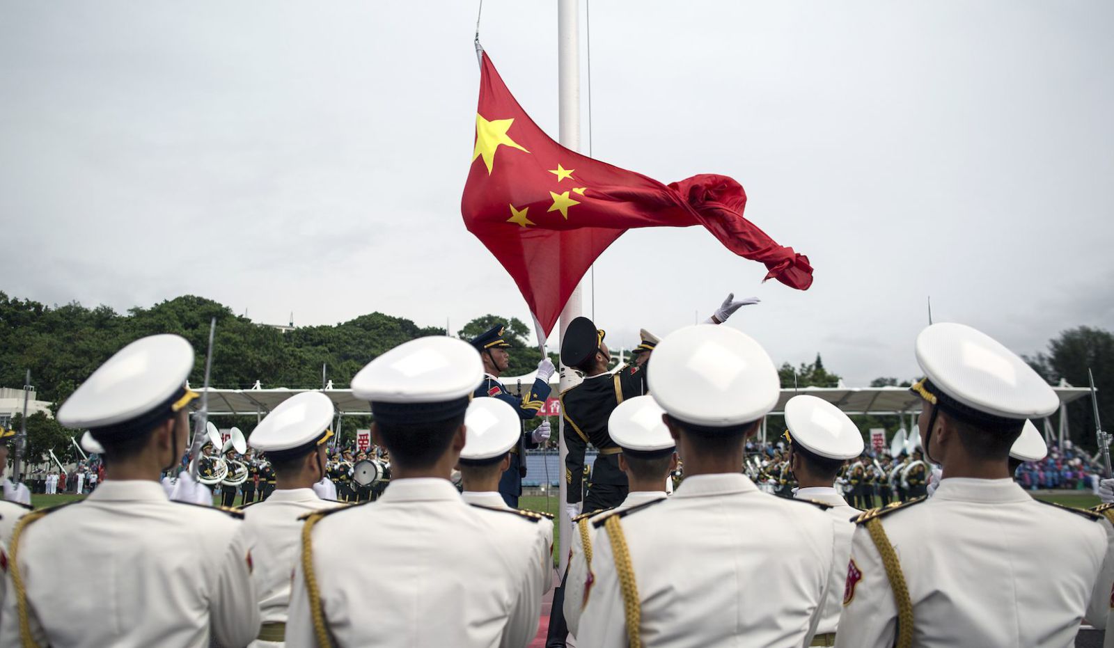 The Peoples Liberation Army PLA soldiers participate in a flag raising ceremony during an open day at the PLA  Navy base in Hong Kong. File: mil.cnr.cn