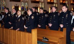 Nearly 40 NYPD police officers attended the annual "Blue" mass at St. Philip Neri Church in Bedford Park.--Photo by David Greene