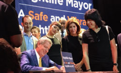 New York City Mayor Bill de Blasio signs a bill establishing the Office of Nightlife at the House of Yes in Bushwick, Brooklyn. Right, Marky Ramone.