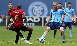 Jun 9, 2018; New York, NY, USA; New York City forward Jo Inge Berget (9) takes the ball downfield against Atlanta United midfielder Darlington Nagbe (6) during the second half at Yankee Stadium. The game ended in a 1-1 tie. Mandatory Credit: Chris Bergmann-USA TODAY Sports