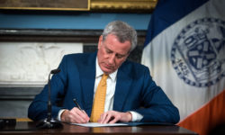 Mayor Bill de Blasio signed Local Law 97 which set costly new carbon emissions limits on condo and co-op residential buildings.