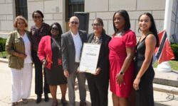 Bronx Borough President Vanessa Gibson (second from right) is joined by community and Consulate of Trinidad and Tobago officials for flag-raising ceremony at Borough Hall to celebrate island nation's 60th anniversary of independence from British rule.